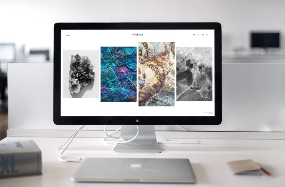 iMac desktop with artistic images of nature on the screen.
